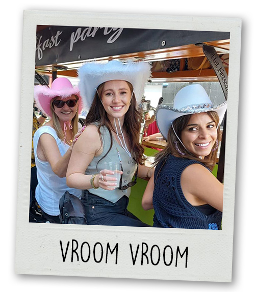 A Polaroid of three women wearing cowboy hats sat on the Belfast Pedi Bike with the caption Vroom Vroom