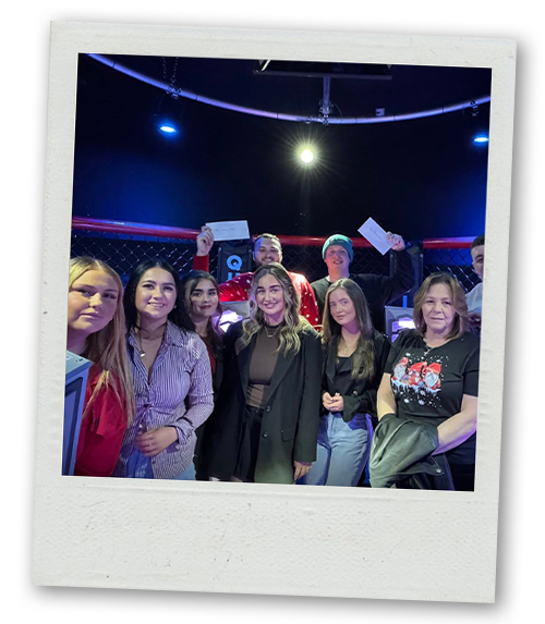 A Polaroid a hen do group posing at Prison Island