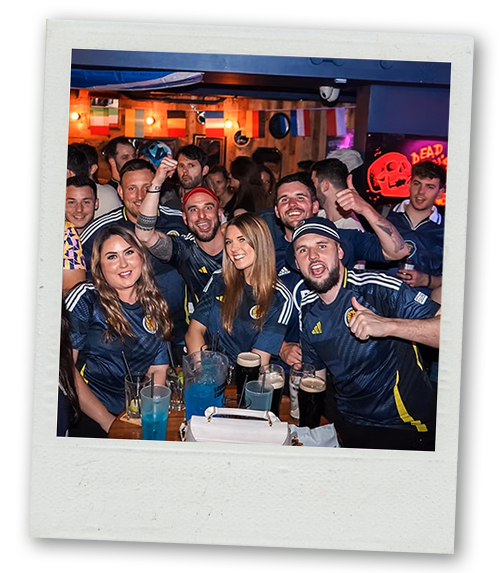 A Polaroid of a mixed gender group out on a bar crawl