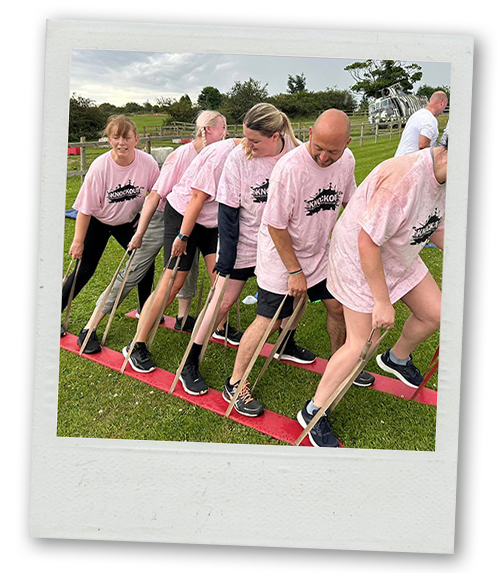 A Polaroid of a group of people doing a team game