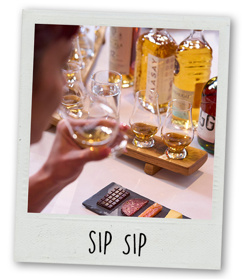 A Polaroid of someone doing whisky tasting with the caption Sip Sip