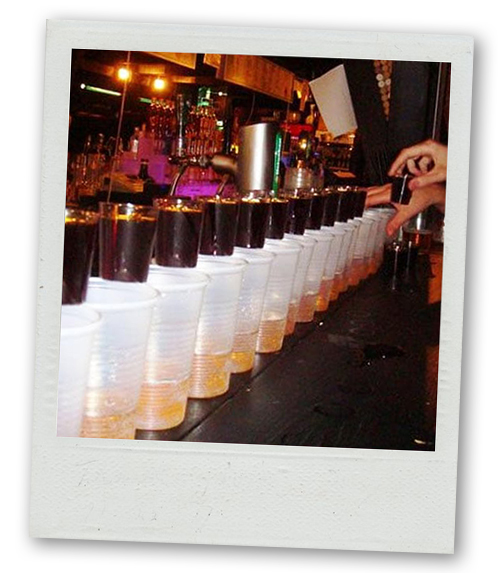 A Polaroid of a line of drinks that have a shot in them