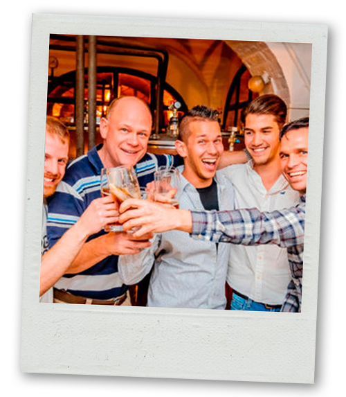 A Polaroid of a group of men clinking glasses
