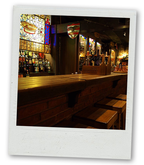 A Polaroid of the bar of a medieval themed restaurant