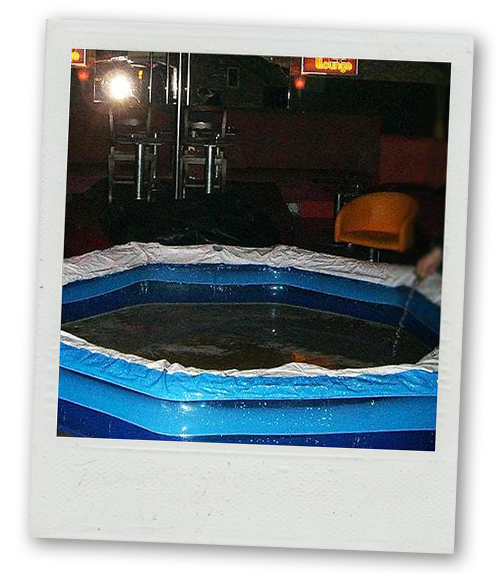 A Polaroid of a little inflatable pool where mud wrestling would take place