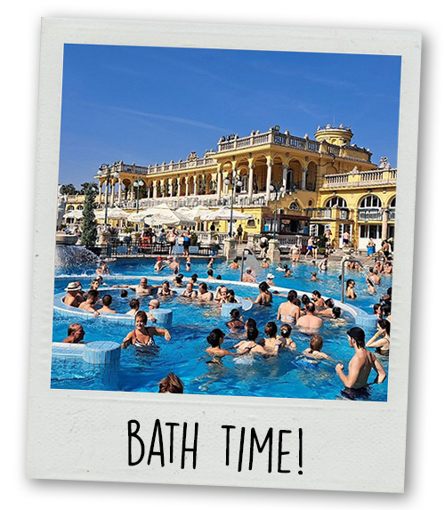 A Polaroid of the Szechenyi thermal baths in the day with the caption Bath Time
