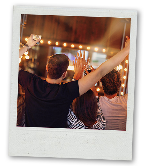 A Polaroid of three people on a bar crawl