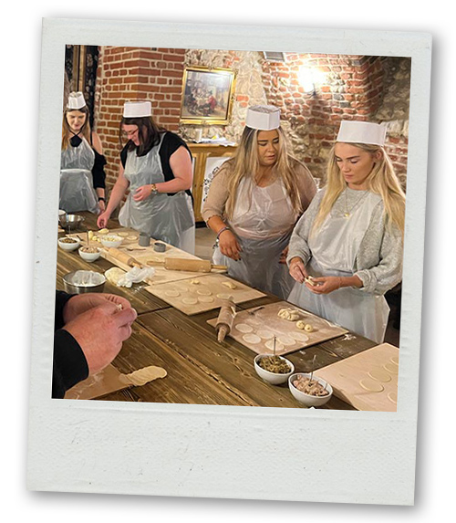 A Polaroid of Last Night of Freedom staff doing the Polish cooking class