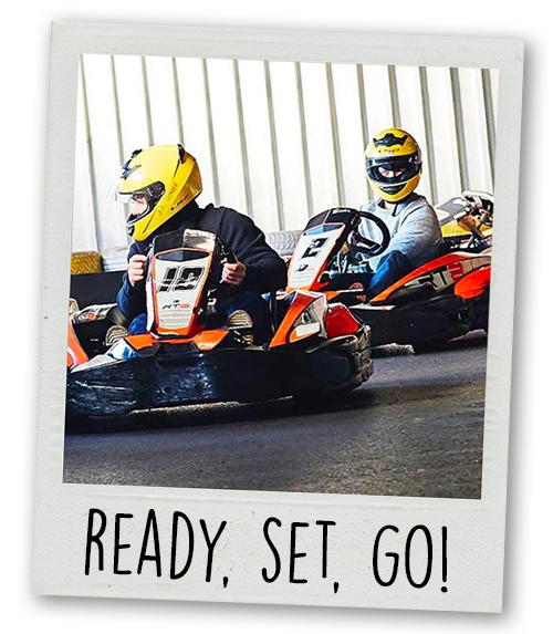 A Polaroid of two men go karting with the caption ready, set, go