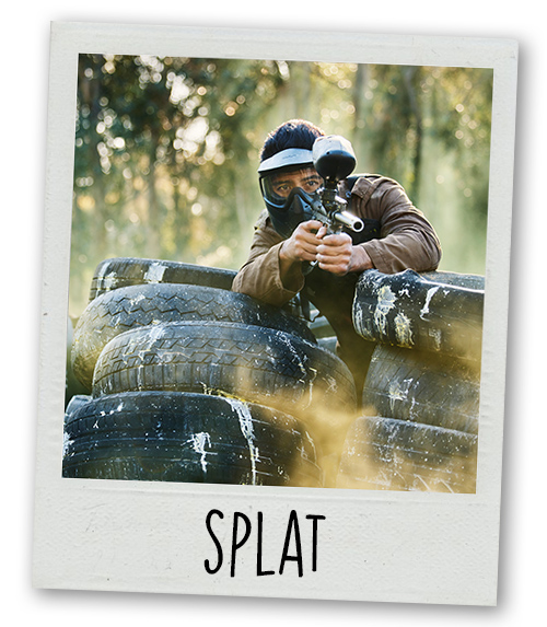 A Polaroid of a man doing paintballing with the caption Splat