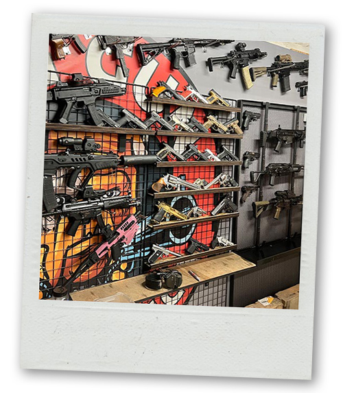 A Polaroid of a large selection of guns