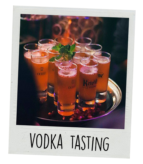 A Polaroid of a tray with vodka on it with the caption Vodka Tasting
