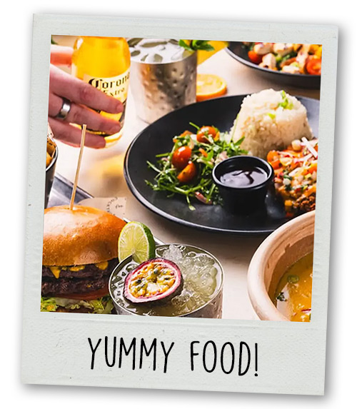 A Polaroid of a selection of food with the caption Yummy Food