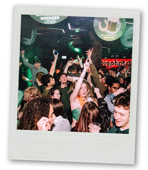 A Polaroid of a group of party goers living it up at Level