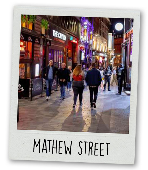 A Polaroid of Mathew Street in the evening with the caption Mathew Street