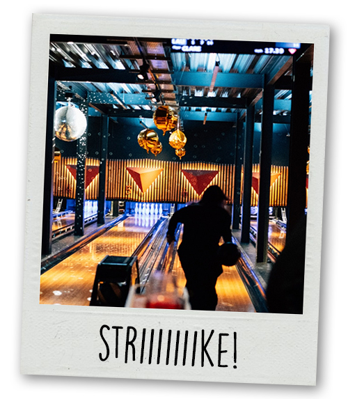 A Polaroid of a woman doing 10 pin bowling at Pins with the caption Striiiiiike!
