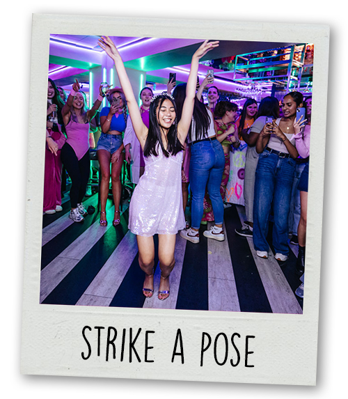A Polaroid of a woman dancing in front of a crowd at Tonight Josephine's with the caption Strike A Pose