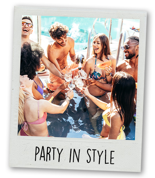 A Polaroid of a mixed gender group of people clinking glasses