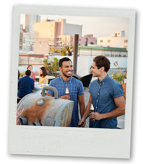 A Polaroid of two men having a drink at a bar