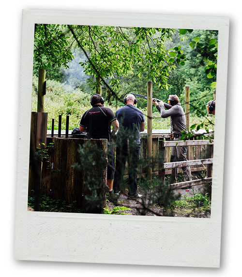 A Polaroid of several men doing clay pigeon shooting