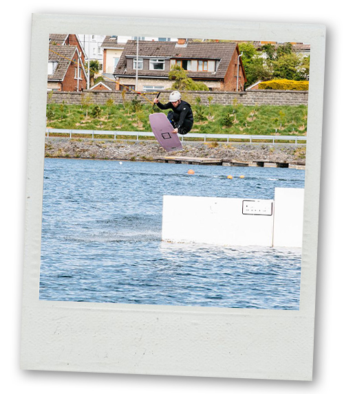 A Polaroid of someone wake boarding