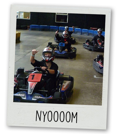 A Polaroid of a stag do go karting with the caption Nyoooom