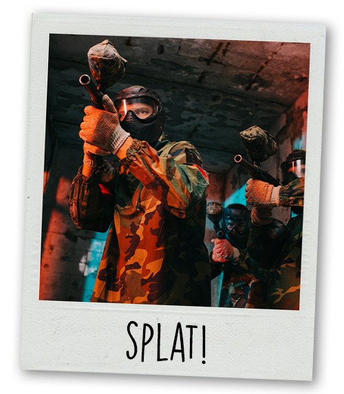 A Polaroid of a man paintballing with the caption Splat