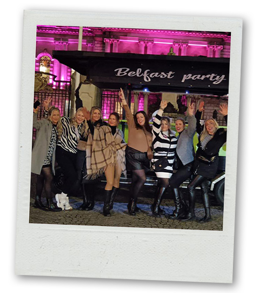 A Polaroid of a hen do group stood in front of a pedi bus