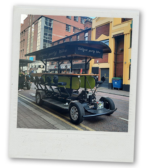 A Polaroid of the Belfast pedi bus with no one on it