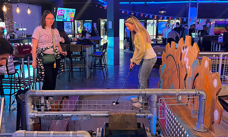 Two women from LNOF playing crazier golf