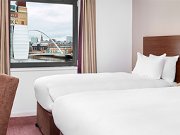 Room with two beds and quayside view 