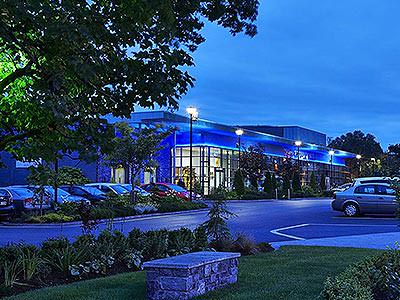 The exterior of The Connacht Hotel at dusk