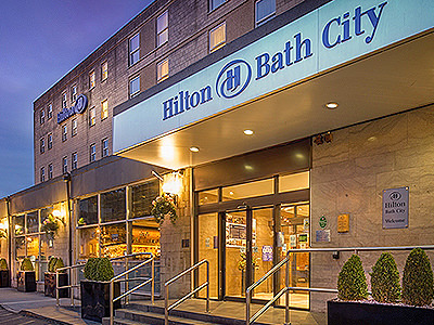 Exterior sign of the Hilton Bath City at night