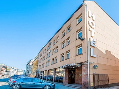 The exterior of Hotel Alexander with flags flying outside