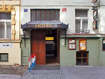 The green, building exterior of the Lublanka Aparthotel 