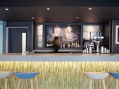 White and blue stools placed in front of bar 