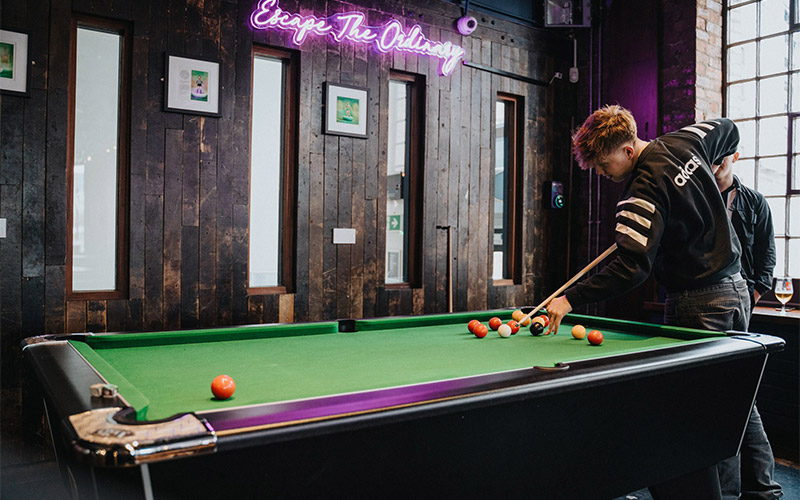 Shoot some games of pool 