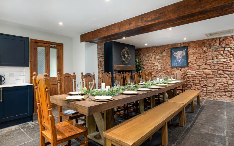 Settle down to a meal at the long dining table 