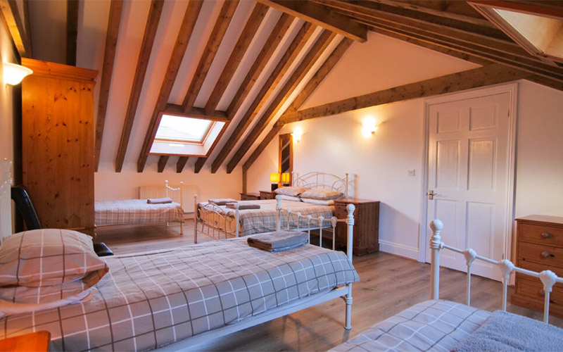 The cottage features quaint wooden beams 