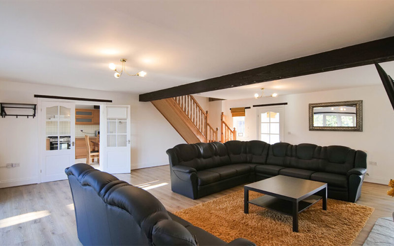 Your spacious living area complete with comfy sofas 