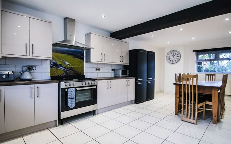 The kitchen is fully equipped with two fridge freezers 