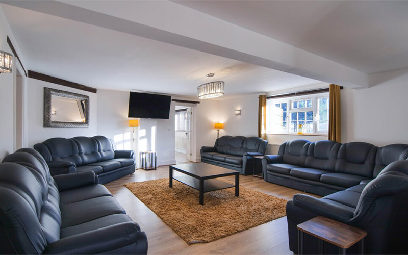 Your spacious living room with comfy sofas and wall mounted TV 
