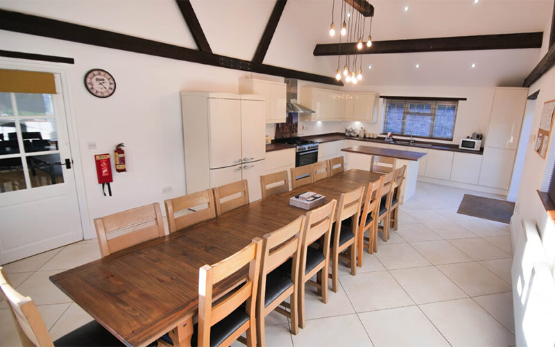 Long dining table ideal for group meals or a takeaway 