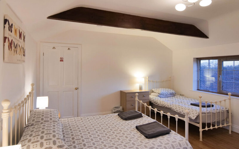 Bedroom with a double and a single bed 