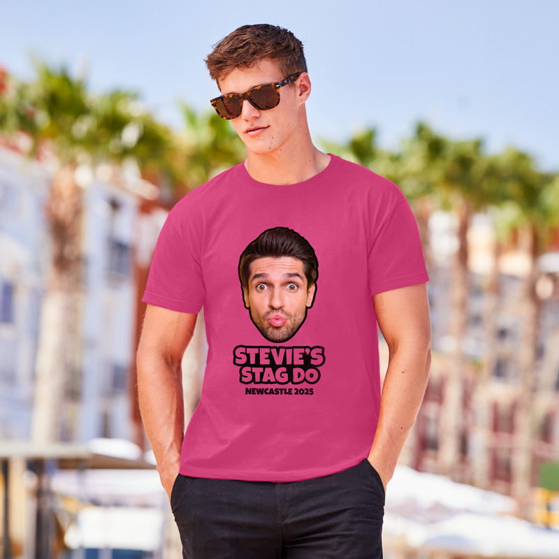 Man wearing pink T-shirt that reads Stevie’s stag do with a man’s face on it 