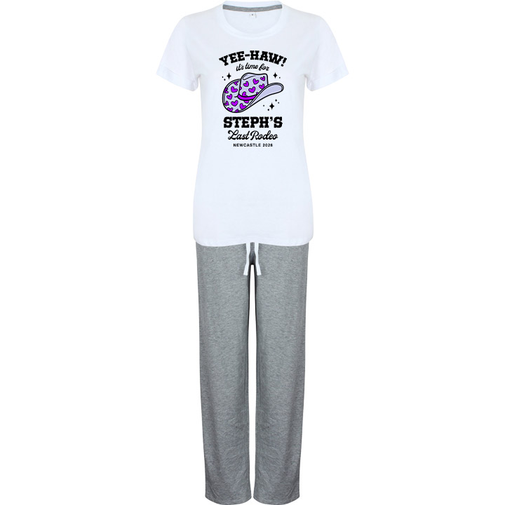 A pair of custom hen do PJs that have a white top and grey bottoms with a cowboy hat deisng with custom text reading Yeehaw it's time for Steph's Last Rodeo Newcastle 2028