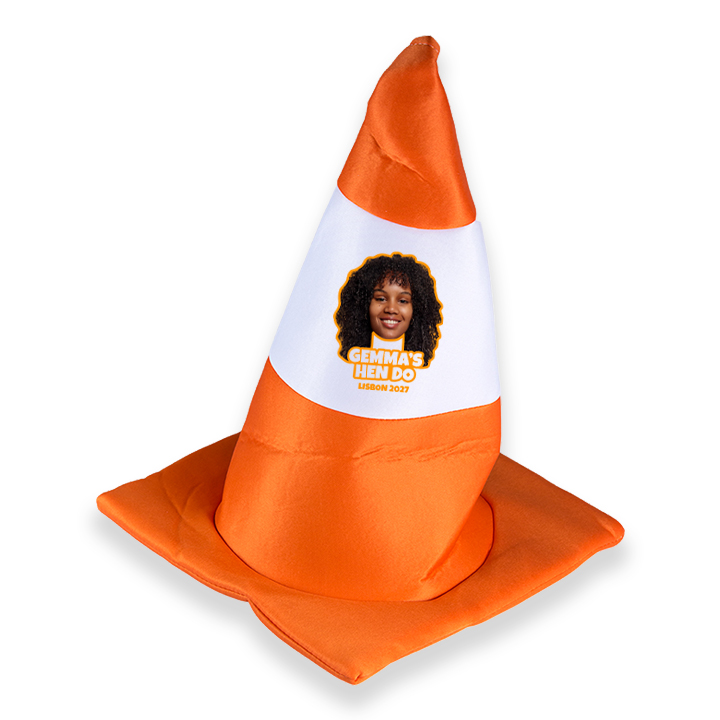 A custom novelty orange and white traffic cone hat which has been personalised with a face photo and 2 lines of custom text reading Gemma's Hen Do Lisbon 2027