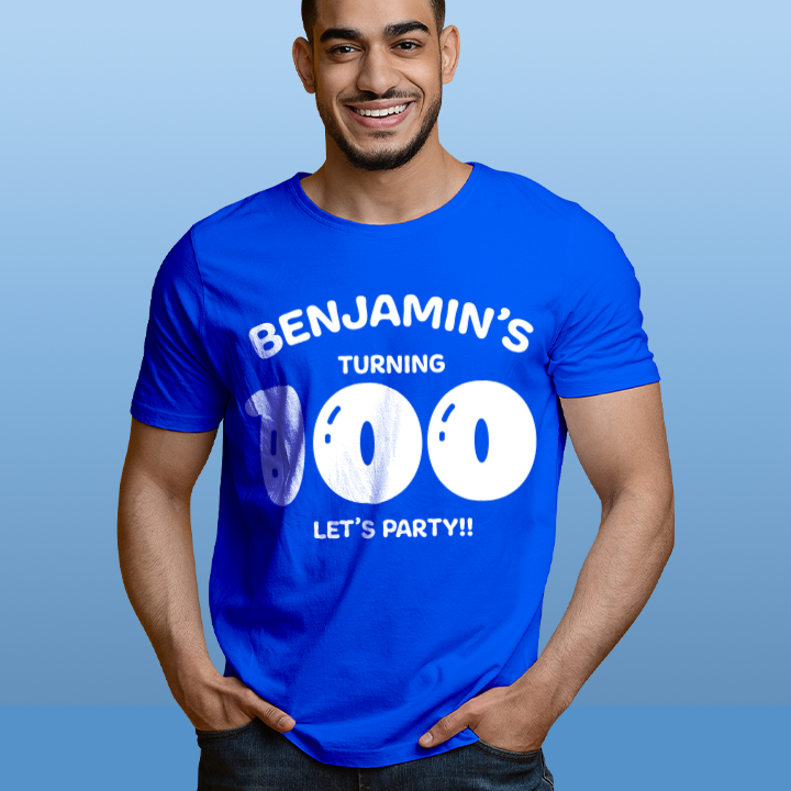 A custom 100th birthday t-shirt which has the custom text Conrad's turning 100, Let's Party!! with the 100 in a balloon text