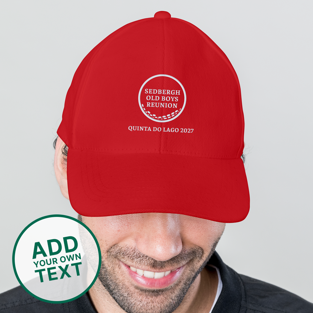 A male model wearing a red custom golf cap with a golf ball design that reads Sedbergh Old Boys Reunion inside the golf ball with Quinta Do Lago 2027 underneath it 