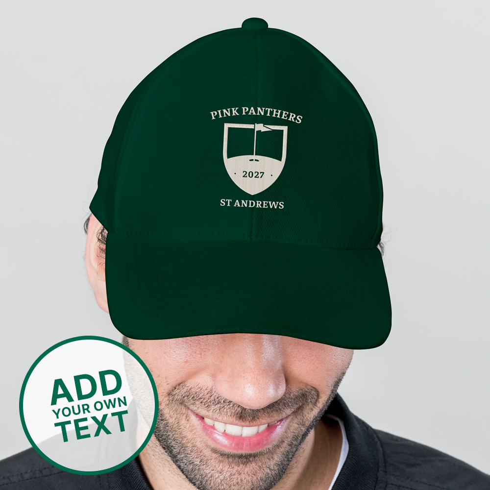 A male model wearing a green custom golf cap with a tour crest design that has been personalised with Pink Panthers, 2027, St Andrews 